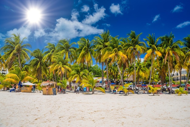 ISLA MUJERES ISLAND MEXICO APR 2022 Cocos beach bar on a beach with white sand and palms on a sunny day Isla Mujeres island Caribbean Sea Cancun Yucatan Mexico