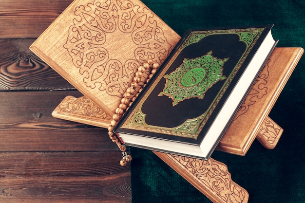 Islamic holy book on wooden surface table