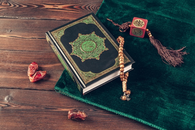 Islamic holy book on wooden table