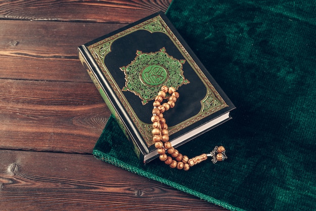 Islamic holy book on wooden table