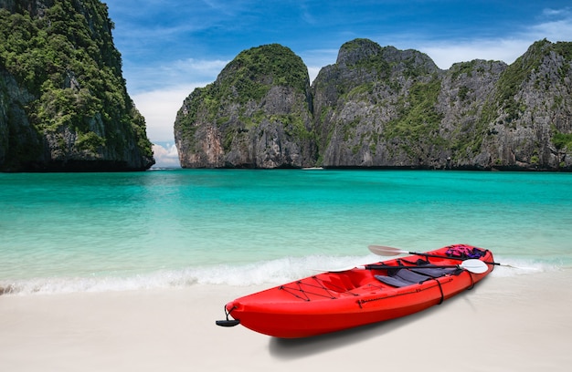 Island blue sea beach and kayak boat with outdoor sun lighting.