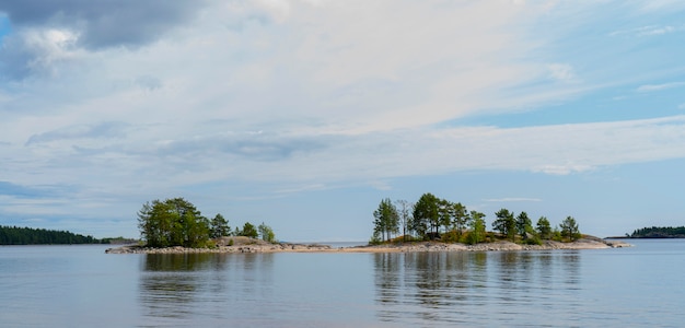 Islands in Lake Ladoga. Beautiful landscape - water, pines and boulders.