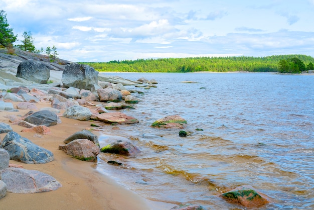 Islands in Lake Ladoga. Beautiful landscape - water, pines and boulders.