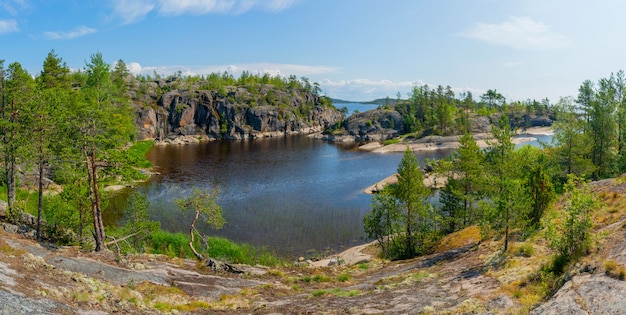 Islands in Lake Ladoga. Beautiful landscape - water, pines and boulders.