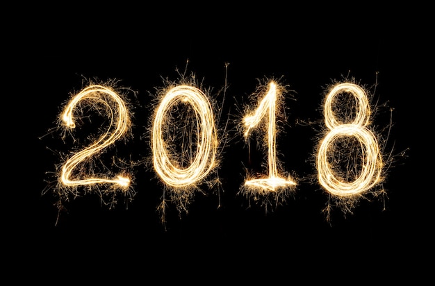 Isolated 2018 written with Sparkle firework .