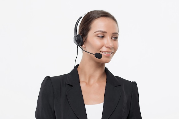 Isolated attractive woman in black costume with headphone looking away