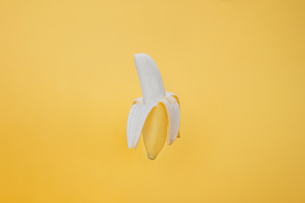 Isolated banana on yellow background