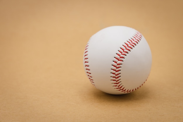 Isolated baseball on a brown background and red stitching baseball. White baseball 