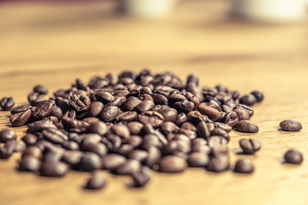 Isolated Caffee Beans of a wooden Table