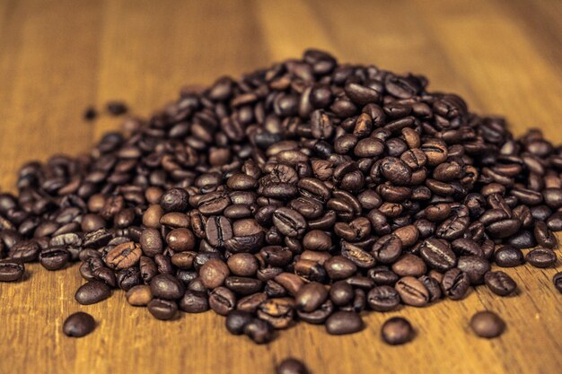 Isolated Coffee Beans on a wooden table