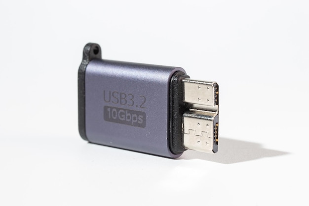 Isolated dark gray USB With HDD adapter on a white background