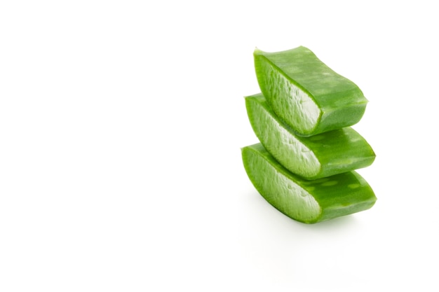 Isolated fresh aloe vera leaves sliced on white background. Aloe vera gel have medical properties for wound healing.