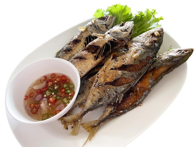 Isolated Fried short mackerel served with paprika fish sauce Asian food Favorite Thailand seafood