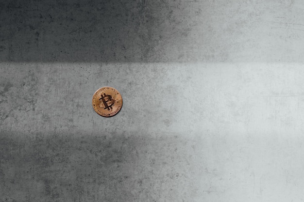 Isolated golden bitcoin on black background with reflection copy space