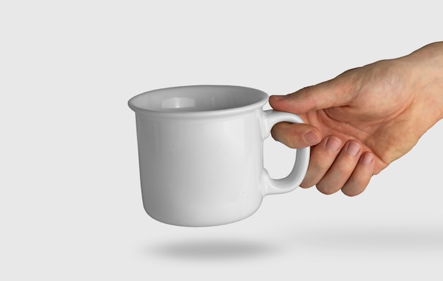 Isolated hand holding a white mug