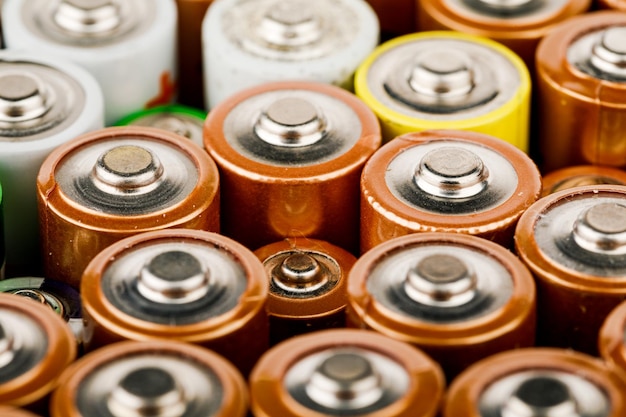 Isolated old battery leakage hazardous waste concept Energy abstract background of colorful batteries