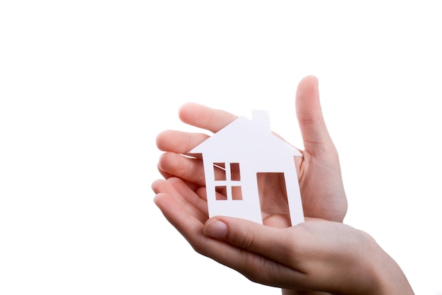 Isolated paper house in hand