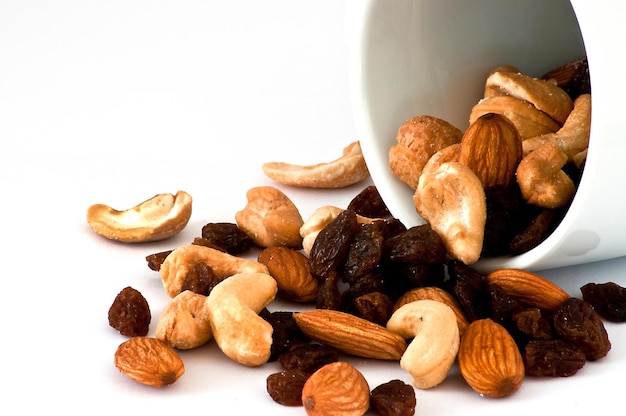 Isolated Spilled mixed nuts on white background