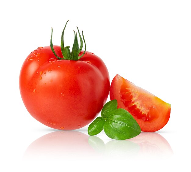 Isolated tomato with slice and basil on white background with clipping path