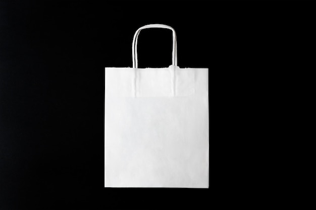 Isolated white paper bag in a black background