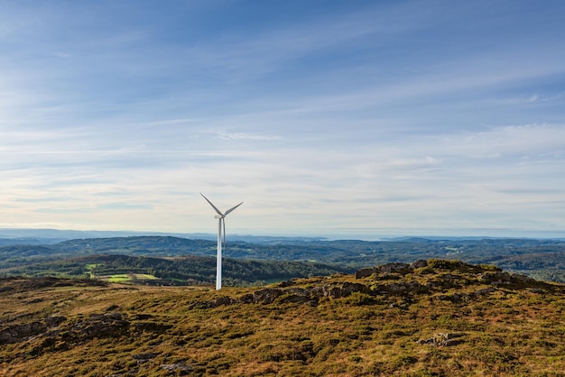 Isolated Wind Generator on top of mountain with copy space