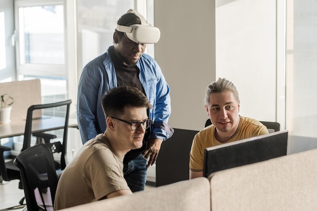 IT Development Team Working on VR Project Man wearing VR headset playing and touching something