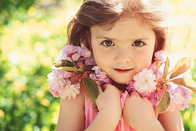 It is spring time Little girl in sunny spring face and skincare allergy to flowers Small child Natural beauty Childrens day Springtime weather forecast Summer girl fashion Happy childhood