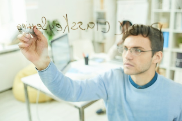 IT Professional Writing on Glass Wall