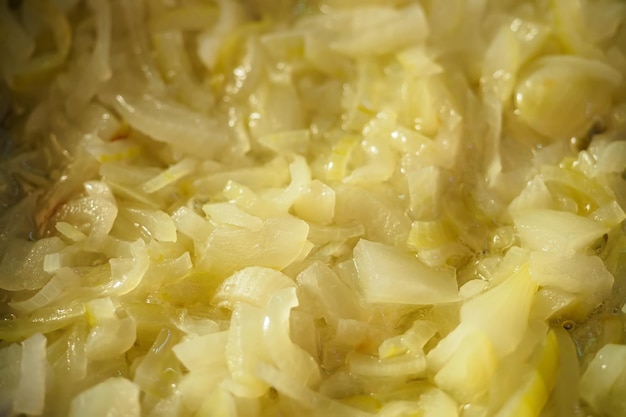 It's fried onions in oil closeup Stewed vegetables