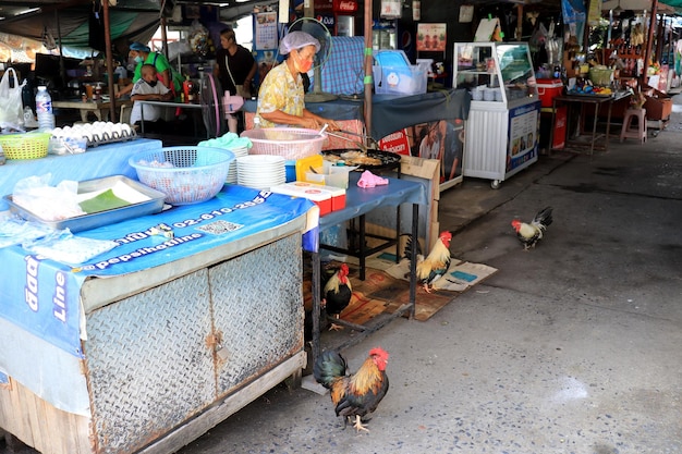 It's a market with chickens walking around.
