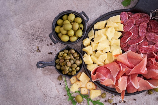 Italian antipasto meat platter prosciutto ham bresaola salami and parmesan