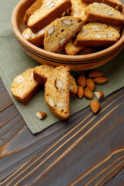 Italian cantuccini cookie with almond filling on wooden table