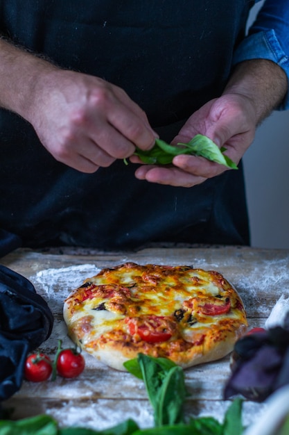 italian chef cooking pizza man hands cooking pizza dough for pizza chefs hands