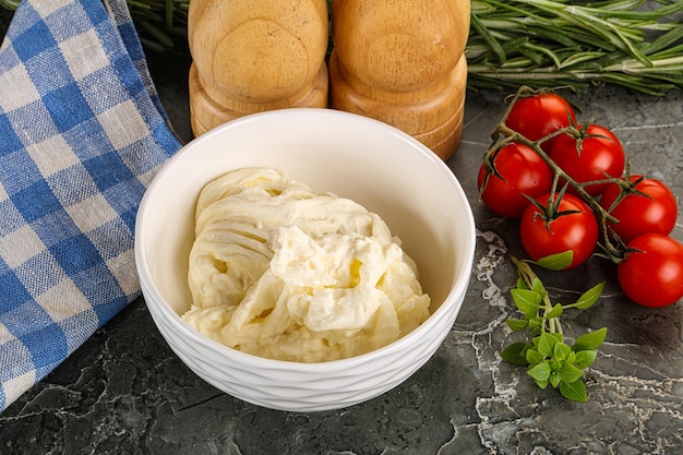 Italian delicous stracciatella cheese in the bowl