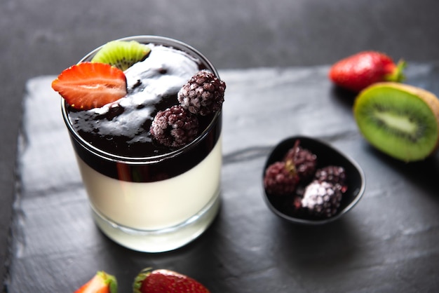 Italian dessert based on tops zucur gelatin and vanilla dessert panacotta on a serving board with st