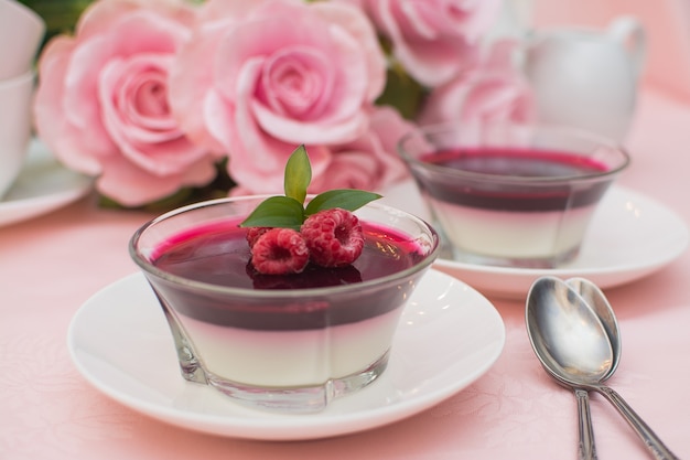 Italian dessert panna cotta with berry sauce, fresh berries.