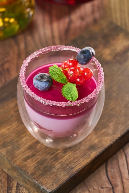 Italian dessert panna cotta with fresh berries and mint