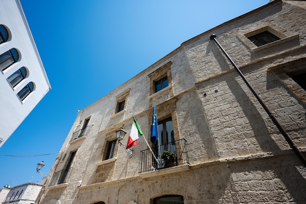 Italian and European Union flags at street of old city Bari Puglia South Italy