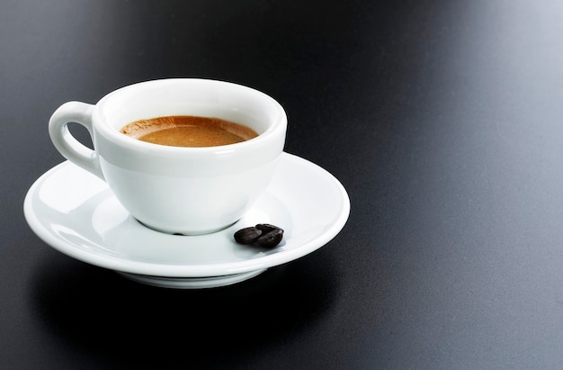 Italian expresso with beans over black