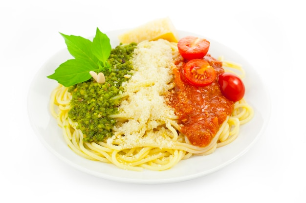 Italian flag pasta with green pesto white parmesan and red tomatoes