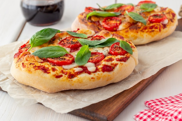 Italian focaccia or pizza with mozzarella, tomatoes and basil.