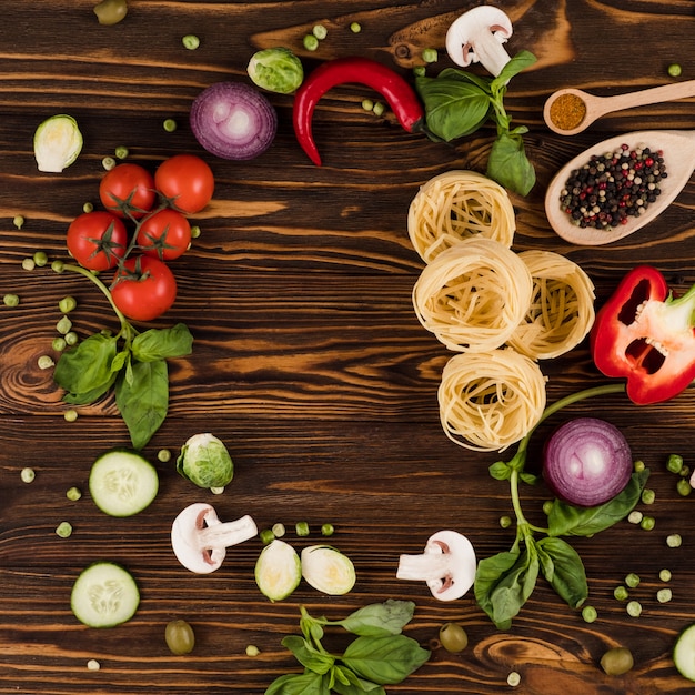 Italian food background with space for text on wooden table, copy space