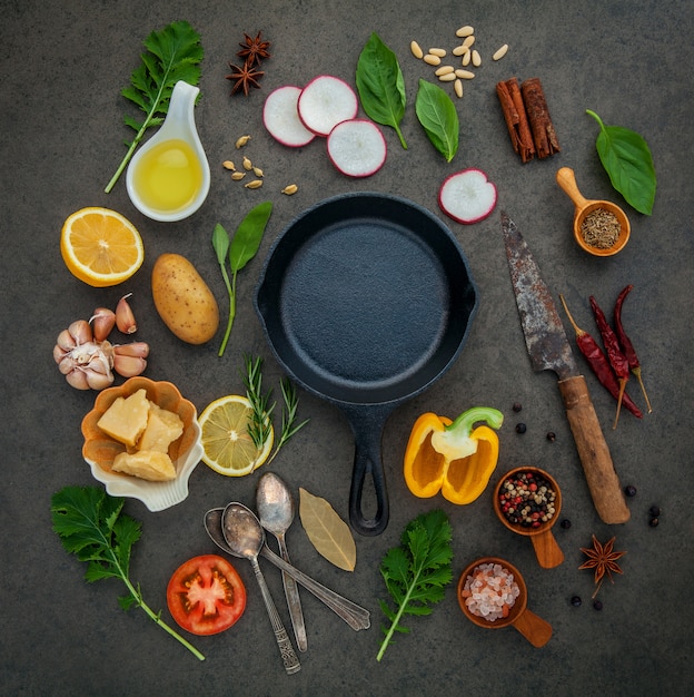 Italian food cooking ingredients with cast iron skillet.