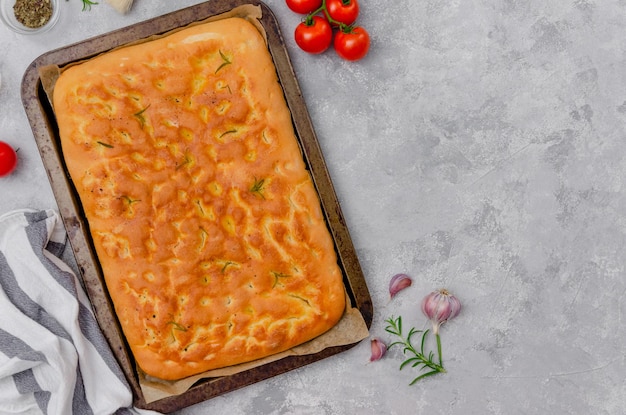 Italian Fresh Baked Focaccia with rosemary garlic sea salt and olive oil Top view copy space