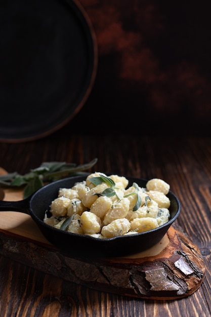 Italian homemade gnocchi with butter, cheese, and sage