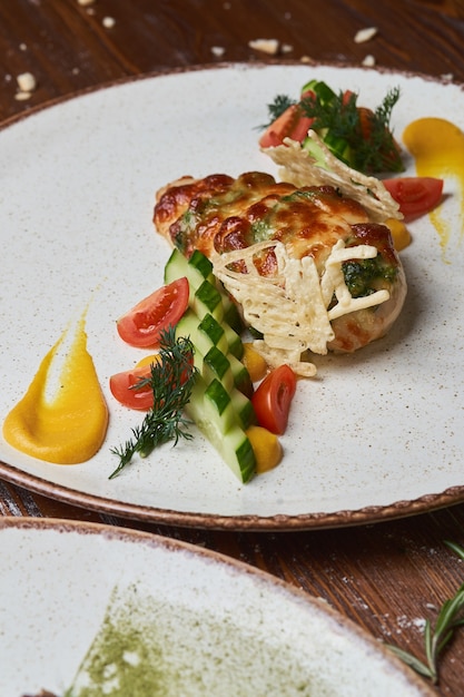 Italian meat, poultry and seafood dishes on a wooden table