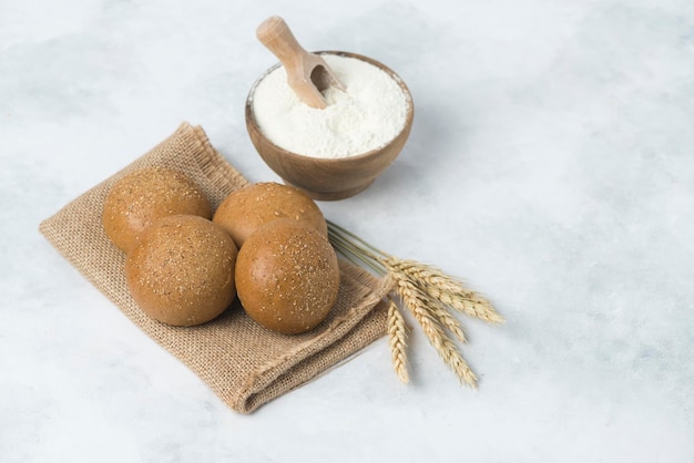 Italian mini black dietic bun bread composition on white background