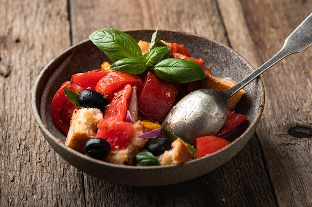 Italian panzanella salad with tomatoes and bread selective focus