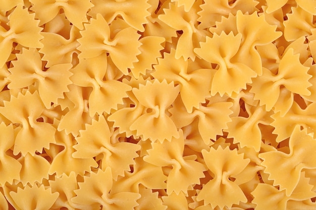 Italian pasta farfalle as background texture