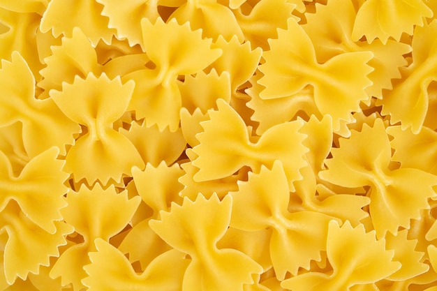 Italian pasta farfalle background Top view